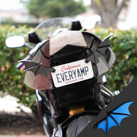 The rear view of a motorcycle displays a California license plate, EVERYAMP, enhanced with EveryAmps License Plate Bat Wings on the tail, securely mounted using eco-friendly SnapPlates made from recycled PETG plastic.