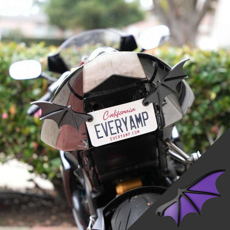 The rear view of a black motorcycle features License Plate Bat Wings decorated from recycled PETG, branded EveryAmp. The plate reads California EVERYAMP, with an inset showing the purple and black bat-wing detail.