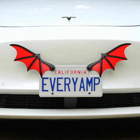 A car sporting a California plate EVERYAMP displays two red License Plate Bat Wings from EveryAmp. These wings enhance its SnapPlates feature, made from recycled PETG plastic, adding an eco-friendly flair to its design.