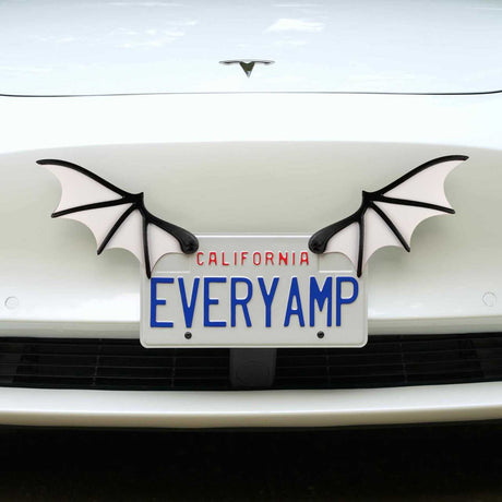 A car with the California SnapPlate reading EVERYAMP cruises down the road, enhanced by EveryAmps License Plate Bat Wings made from recycled PETG plastic.