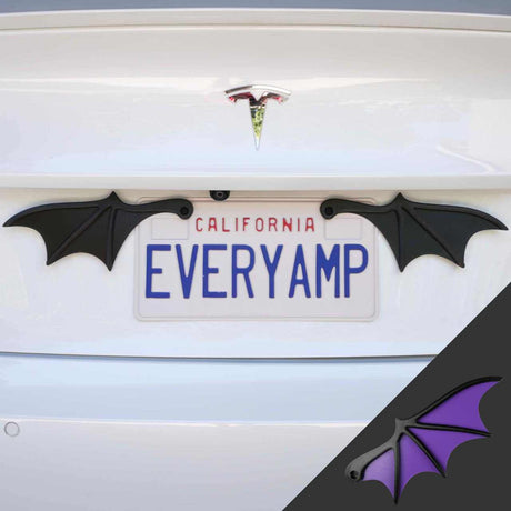 A Tesla with a custom EVERYAMP plate sports EveryAmp License Plate Bat Wings in purple and a SnapPlate made from recycled PETG plastic, enhancing its eco-friendly, sleek design.