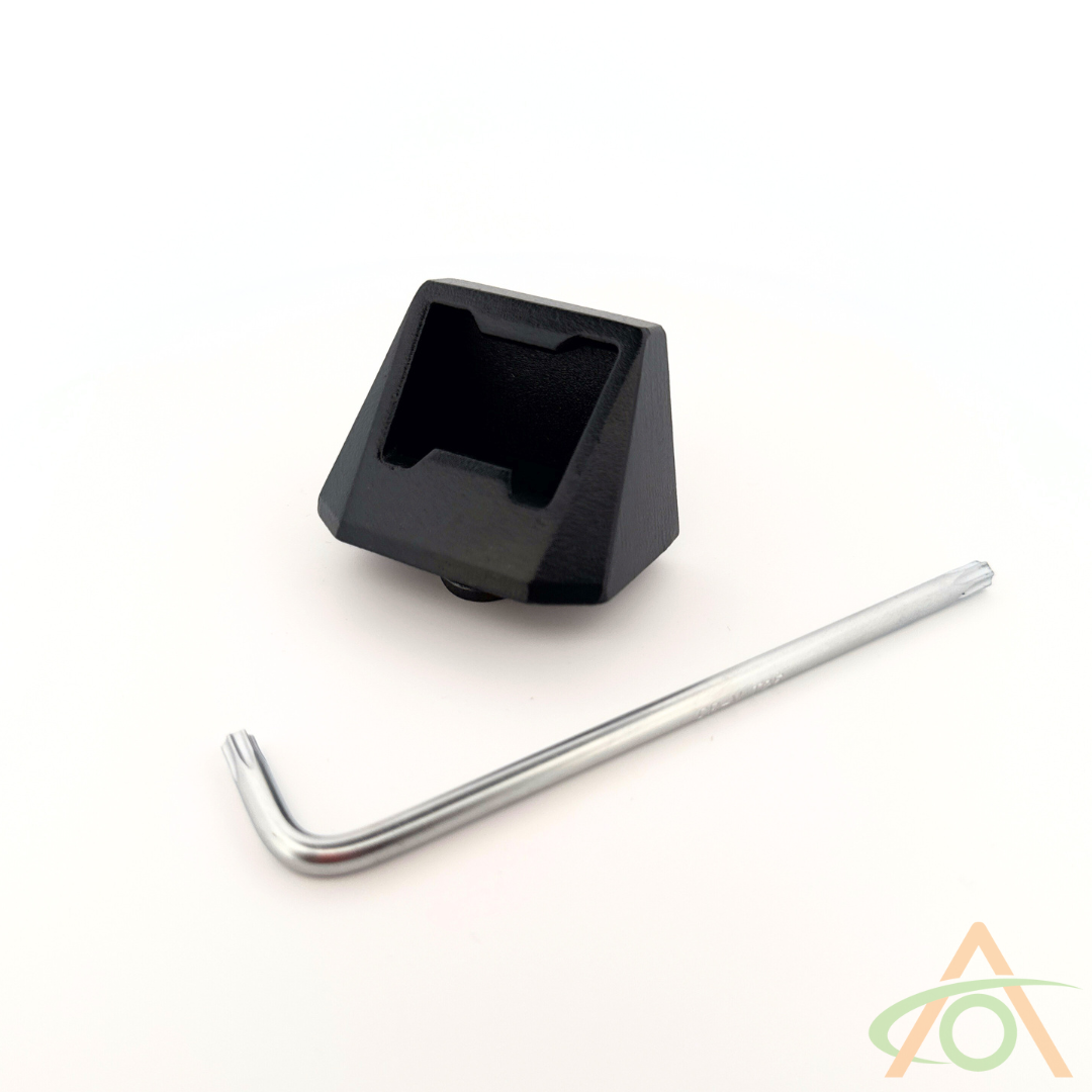 On a white background, a black plastic keycap lies next to a sturdy aluminum hex key. The corner features an Abstract Ocean logo, echoing the style of Cybertruck L-Track Accessories.