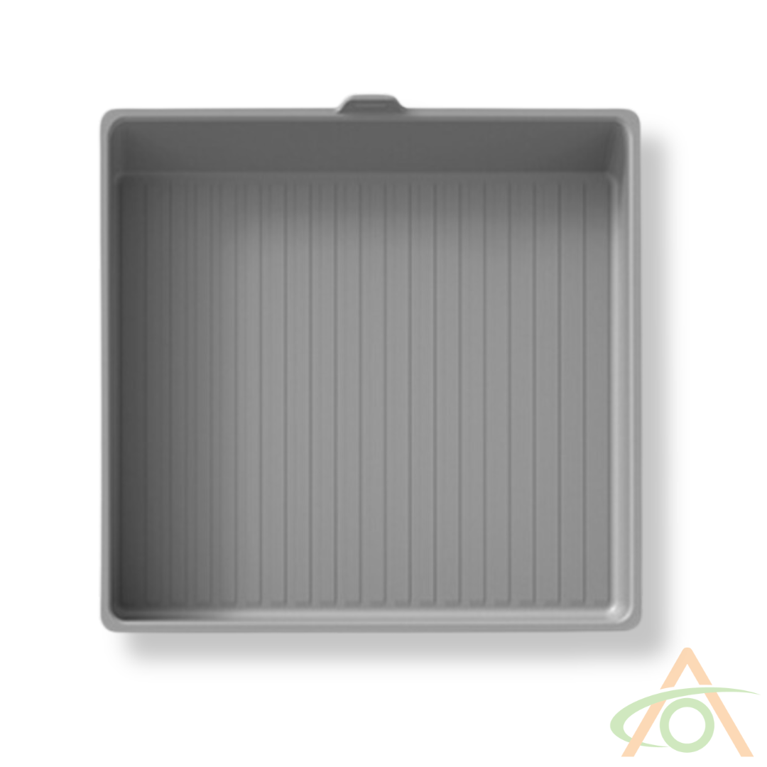 A gray, square baking pan with a ribbed interior surface is crafted from heavy-weight silicone and rests on a white background.
