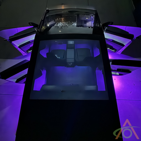 Overhead view of a car with all doors open, illuminated by Abstract Oceans Ultrabright Lights for Cybertruck in vivid purple.
