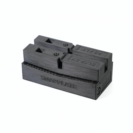 A black plastic SnapPlate Base by EveryAmp, 3D-printed for the Chevrolet Blazer EV (2024+), features SNAPPLATE and directional arrows embossed on its surface.