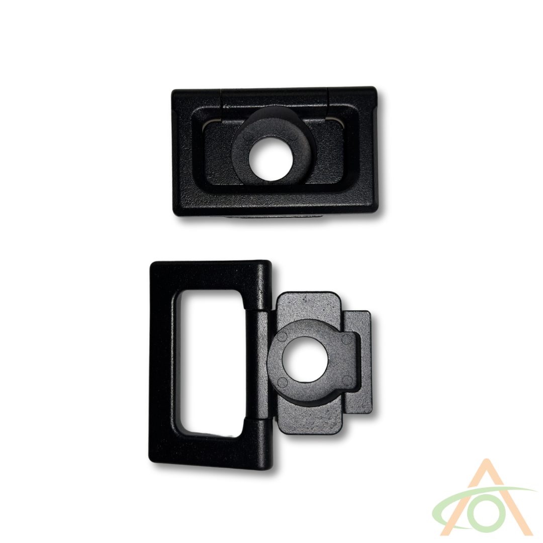 Two black rectangular parts of Abstract Oceans Cybertruck L-Track Accessories appear side by side; one is open, showcasing circular hinges similar to heavy-duty aluminum mechanisms, while the other remains closed, forming a compact unit.