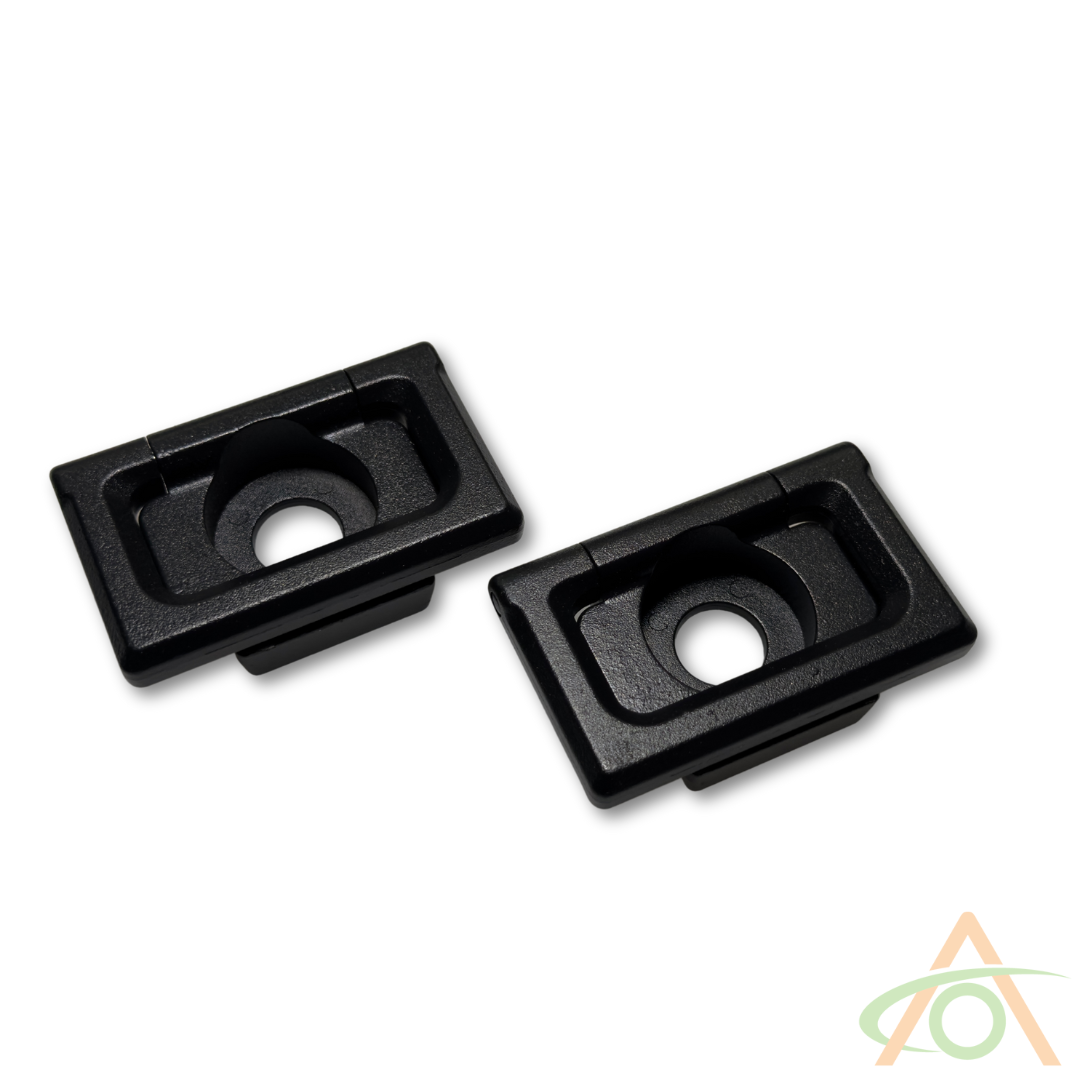 Two black, rectangular plastic mounts with central circular cutouts on a white background, perfect as Abstract Ocean Cybertruck L-Track Accessories.