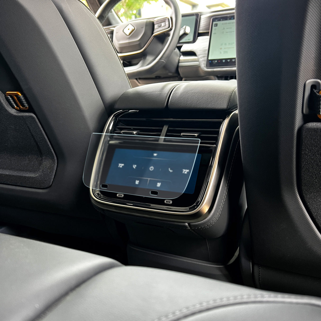 The rear seat console includes a digital climate control display, enhanced with an Abstract Ocean Ultra-Premium Tempered Glass (9H) Screen Protector for durability and clarity.