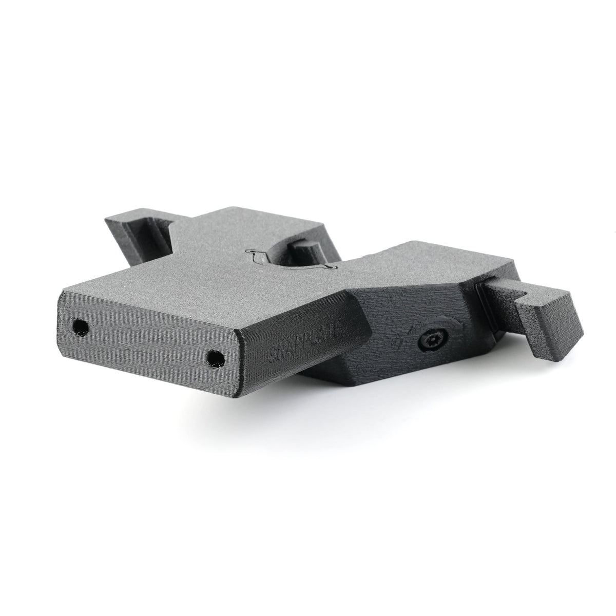 Black textured plastic SnapPlate Base - Rivian R2 (2027) mounting bracket with a central cutout and two screw holes on the front face.