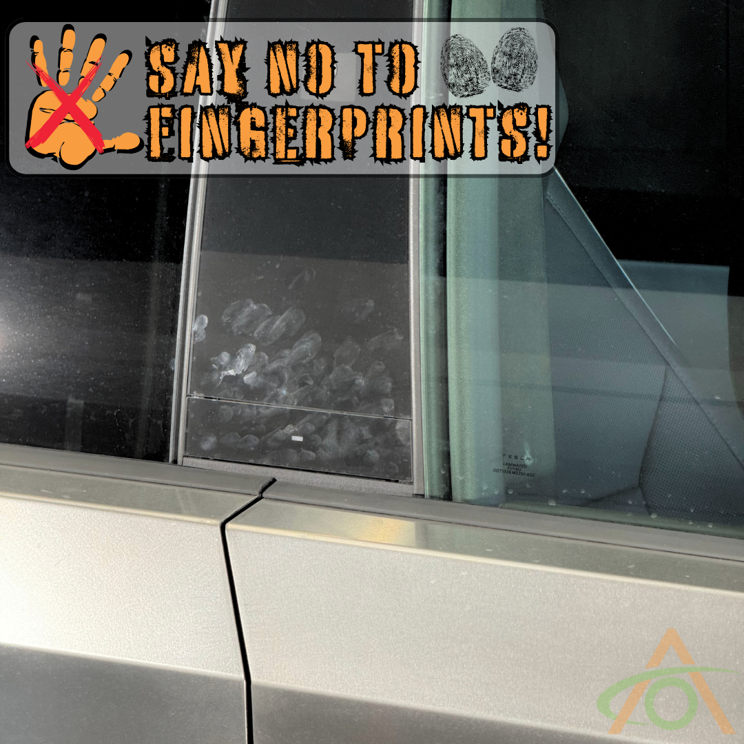 The window of a car door shows fingerprints, highlighted by a graphic with Say No to Fingerprints! and a hand with an X. For pristine B-Pillars protection, consider using Abstract Oceans B & C Pillar Protection - PPF for Cybertruck.