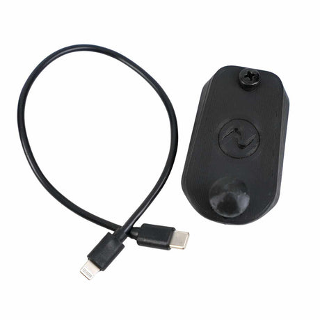 EveryAmp Back Seat Tablet/Phone Mount Anchor for Rivian R1T and R1S—a black device with a circular symbol, screw, and short USB-C/Lightning cable, perfect for 3D-printed ball mounts or other seat back accessories.