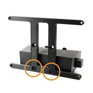 A black bracket with a rectangular base, featuring two vertical supports. Two screws are highlighted with orange circles near the bottom.