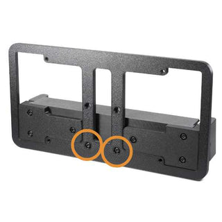 A black metal mounting bracket with multiple screws and two orange circles highlighting specific screws.