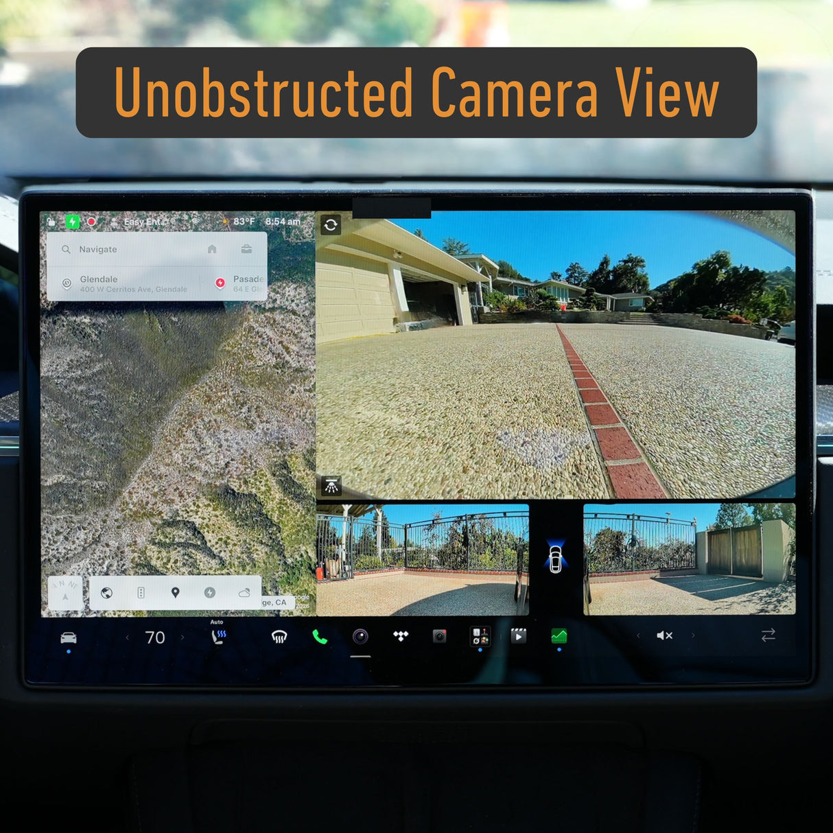 A car dashboard displays navigation on the left and three clear backup camera views showing a driveway and gate on the right. A label reading "Unobstructed Camera View" highlights the benefit of using a removable license plate holder like the EveryAmp Tesla Model S SnapPlate Front License Plate Holder, which keeps your cameras free from obstruction.