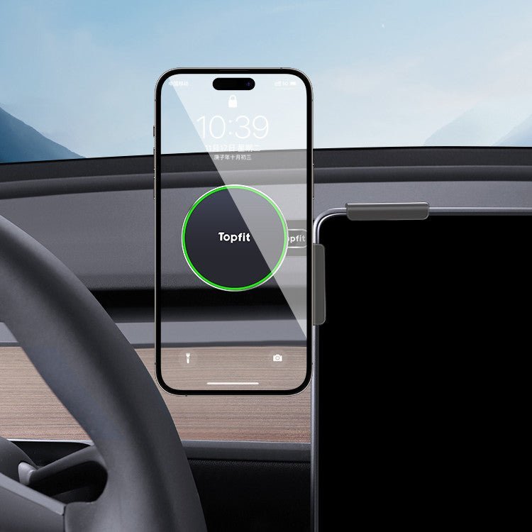 A Magnetic Wireless Charging Phone Holder from Tesery Official Store is mounted in a car, displaying a charging smartphone with the steering wheel in view—perfect for Model 3 Highland and Model Y Juniper owners.