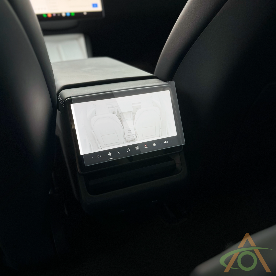 An Abstract Ocean Ultra-Premium Tempered Glass (9H) Screen Protector is mounted on the rear center console display of a refreshed Model 3 or Y, providing a durable, clear digital interface for vehicle controls.
