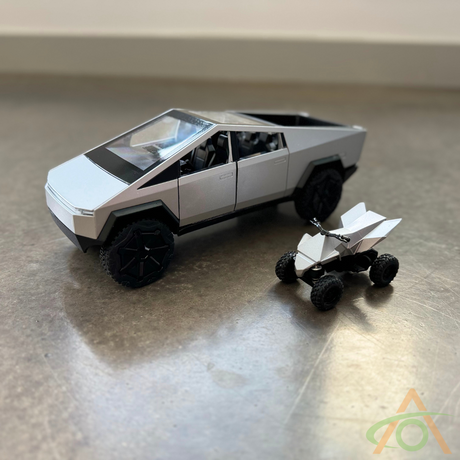 The Abstract Ocean 1:24 Scale Cybertruck + Cyberquad Diecast set features a sleek, angular design, offering a futuristic allure in miniature form.