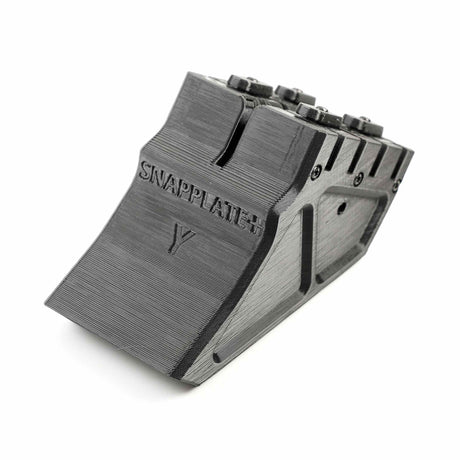 The EveryAmp SnapPlate+ Base for Tesla Model Y (2020-2025) is a 3D-printed black mount with a sloped front, grooves, and visible bolts on top—serving as a sleek SNAPPLATE-labeled replacement part.