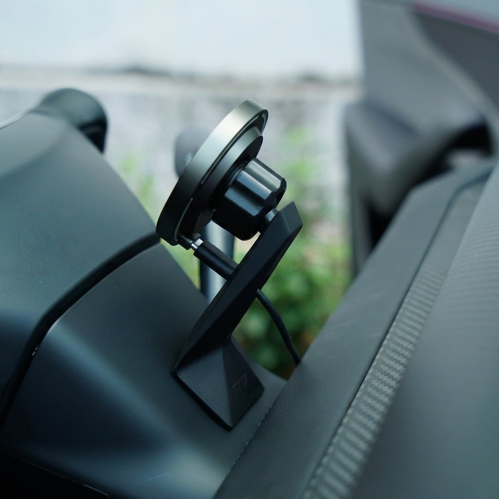 The Tesery MagLink HUD, an OLED magnetic dashboard display for Model Y Juniper/Model 3 Highland by Tesery Official Store, sits on the car dashboard with a charging cable connected, wrapped in a sleek protective product cover.