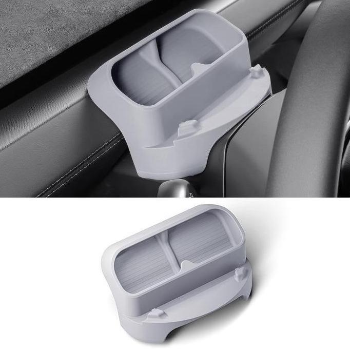 The Tesery Official Store Sunglasses & Phone Holder Organizer for Model Y Juniper is a gray plastic organizer with two compartments, designed to attach next to your car window and steering wheel for convenient storage.