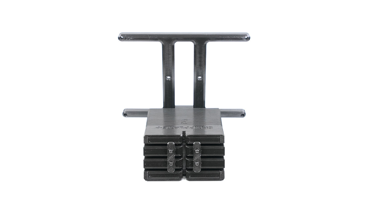 Front view of a black metal industrial clamp with a T-shaped design and multiple adjustable layers.