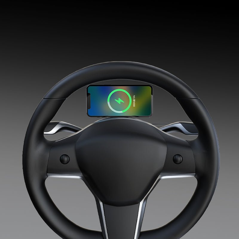 A smartphone is mounted on the Tesery Official Store Magsafe Wireless Charging Phone Holder for Model Y/3 Highland, securely attached to the top center of a Tesla Model Y & 3 steering wheel.