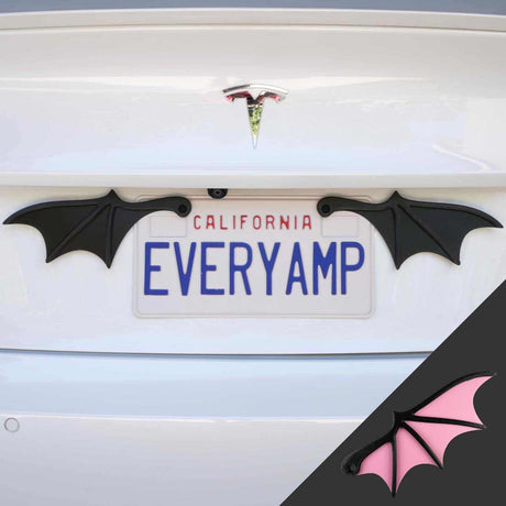 A Tesla with California license plate EVERYAMP is fitted with EveryAmps License Plate Bat Wings in pink, crafted from recycled PETG plastic. An inset image shows a close-up of a bat wing, capturing its eerie elegance.