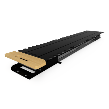 The Thunderbolt Adventure Supply Overland Gear Sled for the Rivian R1T features a black metal and wood adjustable track jig with zigzag edges, designed for precise woodworking and fits perfectly in your R1T Gear Tunnel storage system.