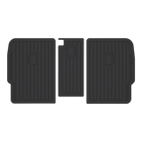 Three black, rectangular LinerX Seat Back Cover Mats for 2022-2026 Rivian R1S, featuring vertical grooves, are arranged side by side—a durable accessory and ideal protection for your vehicle.