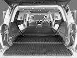 View from the open rear hatch of a Rivian R1S (2022-2026) with back seats folded flat and spacious cargo area, featuring the LinerX Cargo Liner by LinerX for all-weather protection and easy organization of your accessories.