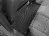 Black ribbed LinerX Floor Mats for Rivian R2 (2027) installed in the rear passenger area.