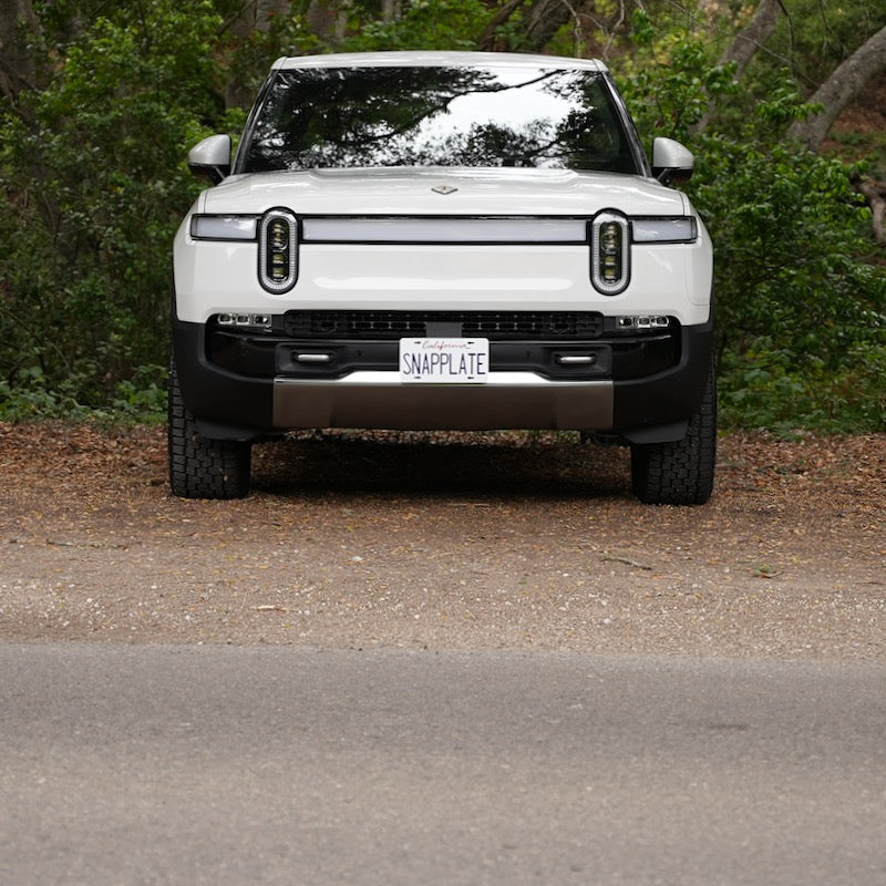 Rivian R1T shown with a SnapPlate front license plate holder installed