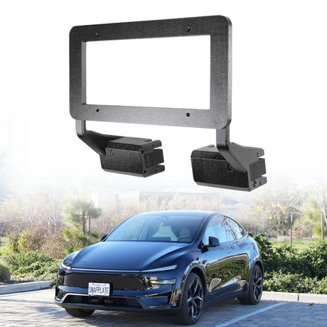 An EveryAmp Tesla Model Y SnapPlate Front License Plate Holder in black is shown above a blue car with a front license plate, parked outdoors on a stone driveway with trees.