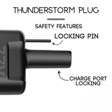 Close-up of a black A2Z CCS1 Charger to NACS Vehicle Adapter showing labeled locking pin and charge port locking safety features, designed for Level 3 DC fast charging or use with a Tesla CCS adapter.