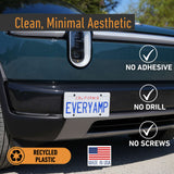 A Rivian R2 features an EveryAmp Tow Hook Front License Plate Mount—no adhesive, drilling, or screws needed. Made in the USA from recycled PETG plastic.