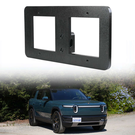 An EveryAmp Tow Hook Front License Plate Mount for Rivian R2, made from recycled PETG, is shown above a green Rivian R1S parked outdoors with a custom "EVERY AMP" front plate.