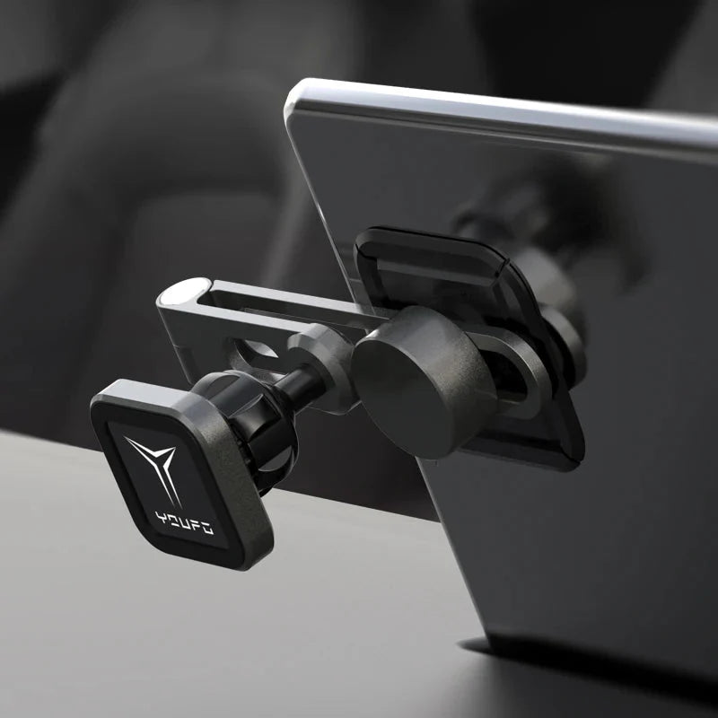 A close-up of the Tesery Official Store Center Screen Magnetic Phone Holder for Model 3/Y/S/X/Cybertruck, securely mounted on the center console with its adjustable arm keeping a smartphone firmly in place.