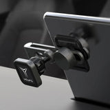 A close-up of the Tesery Official Store Center Screen Magnetic Phone Holder for Model 3/Y/S/X/Cybertruck, securely mounted on the center console with its adjustable arm keeping a smartphone firmly in place.