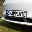 Close View Of A Euro Number Plate Installed On A Dual Base Snapplate On A Tesla Model Y