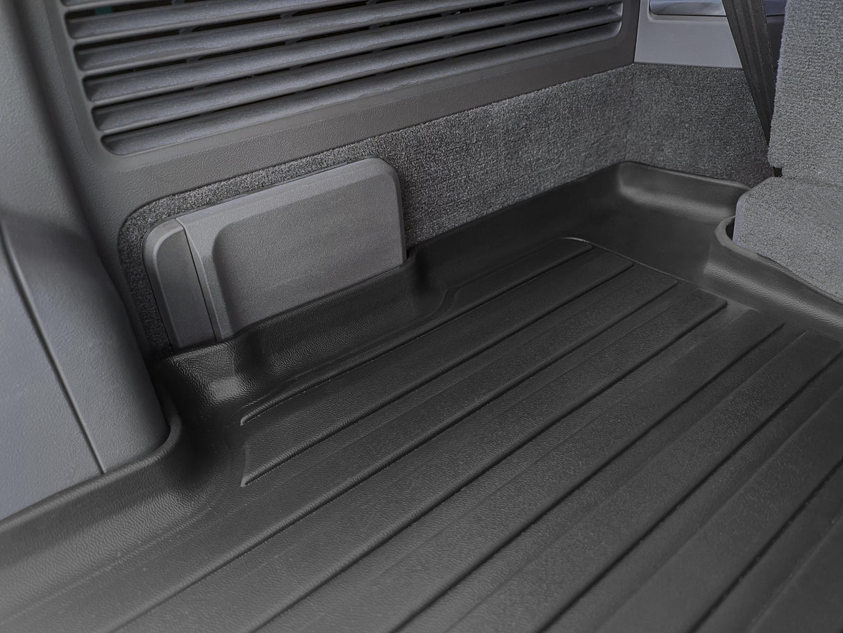 Close-up of the LinerX Cargo Liner for 2022-2026 Rivian R1S, featuring a clean black finish with textured panels, covering the rear floor—an ideal all-weather accessory by LinerX for your R1S.
