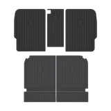 Four black, rectangular LinerX Seat Back Cover Mats for 2022-2026 Rivian R1S, featuring ribbed surfaces and made of thermoplastic, are arranged in two rows on a plain background.