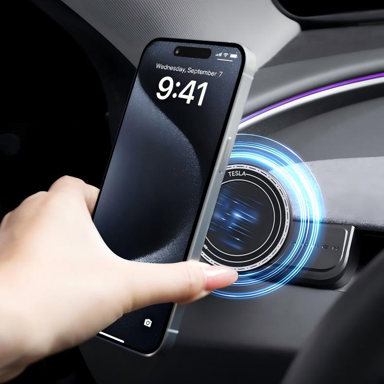 A hand holds a smartphone near the Tesery Magnetic Dashboard Phone Mount for Model 3 Highland/Model Y Juniper, with blue charging lights inside a car, highlighting the convenience of this mount from Tesery Official Store.