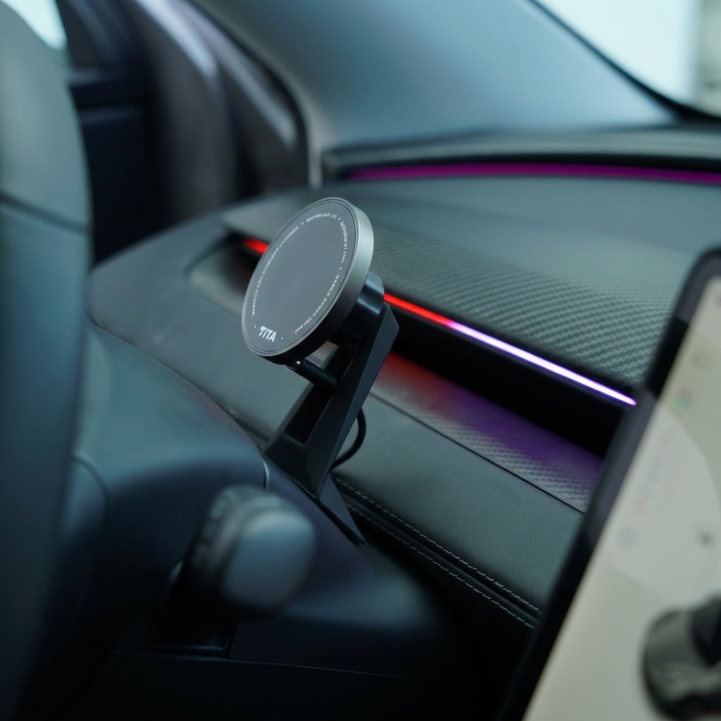 A close-up of the Tesery MagLink HUD, an OLED magnetic dashboard display for Model Y Juniper / Model 3 Highland by Tesery Official Store, mounted on a vehicle dashboard with ambient colored lights in the background.
